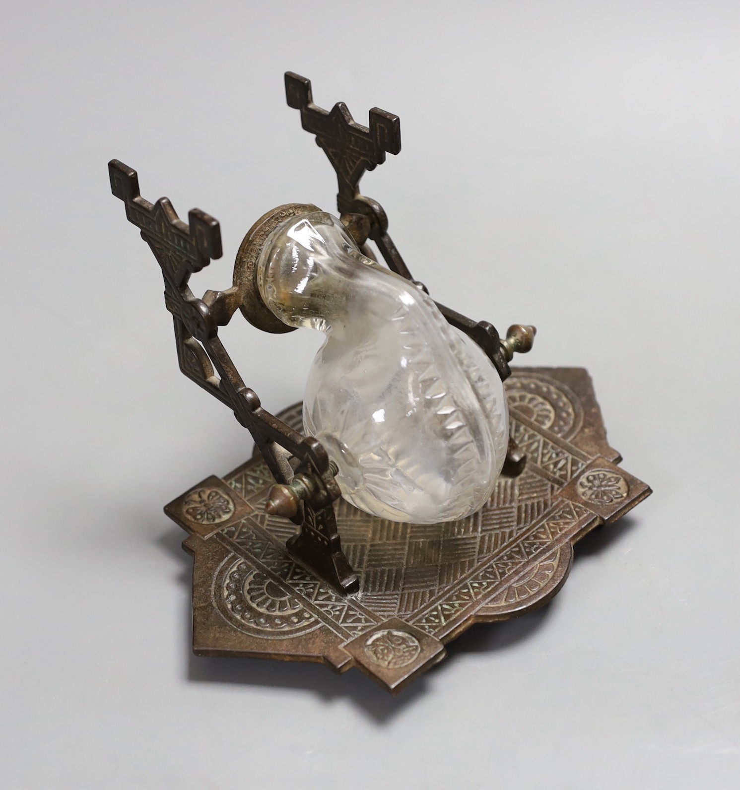 A Victorian patent inkstand embossed with embossed owl and butterfly motifs, attributed to Thomas Jeckyll, 11cm tall